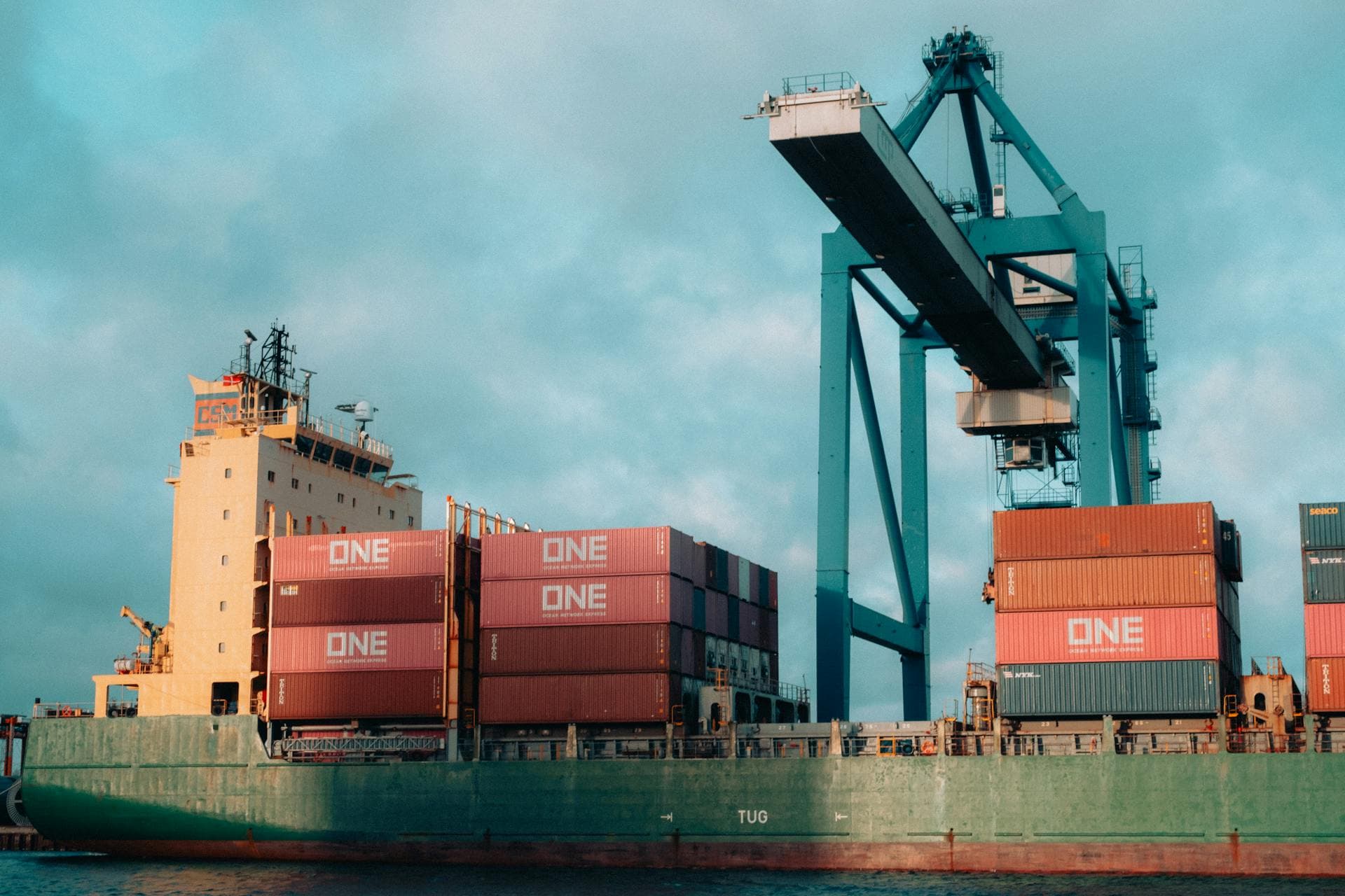 ONE containers with teal crane - Infinity Logistics China to UAE corridor