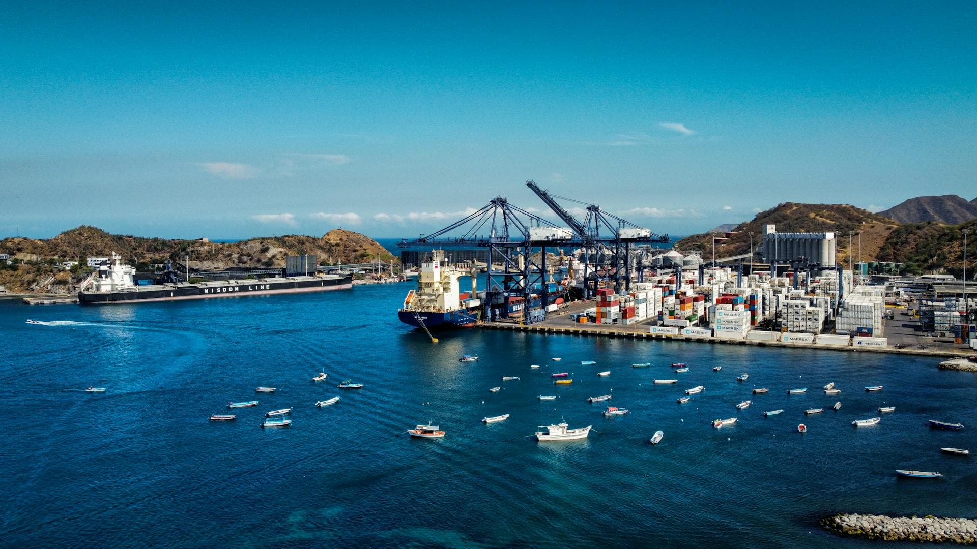 Aerial view of vibrant port with blue water — Infinity Logistics customs clearance services