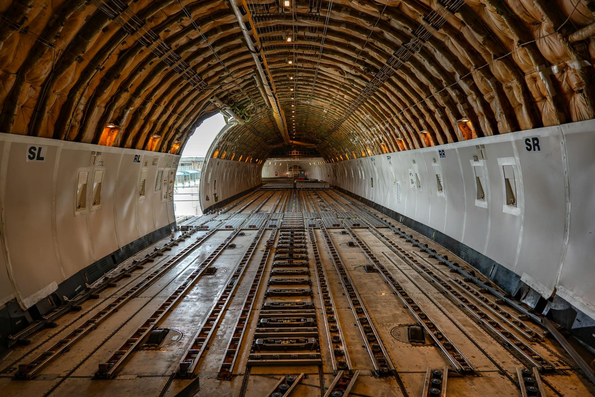 Empty cargo hold interior of freight aircraft — Infinity Logistics air freight technology