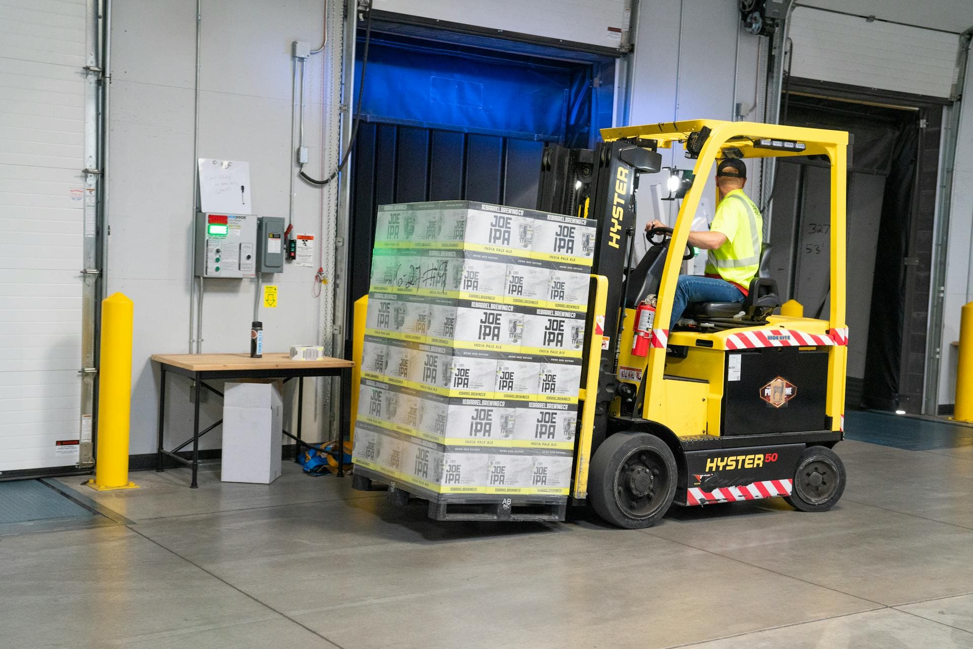 Hyster forklift moving pallets in warehouse operations — Infinity Logistics warehousing