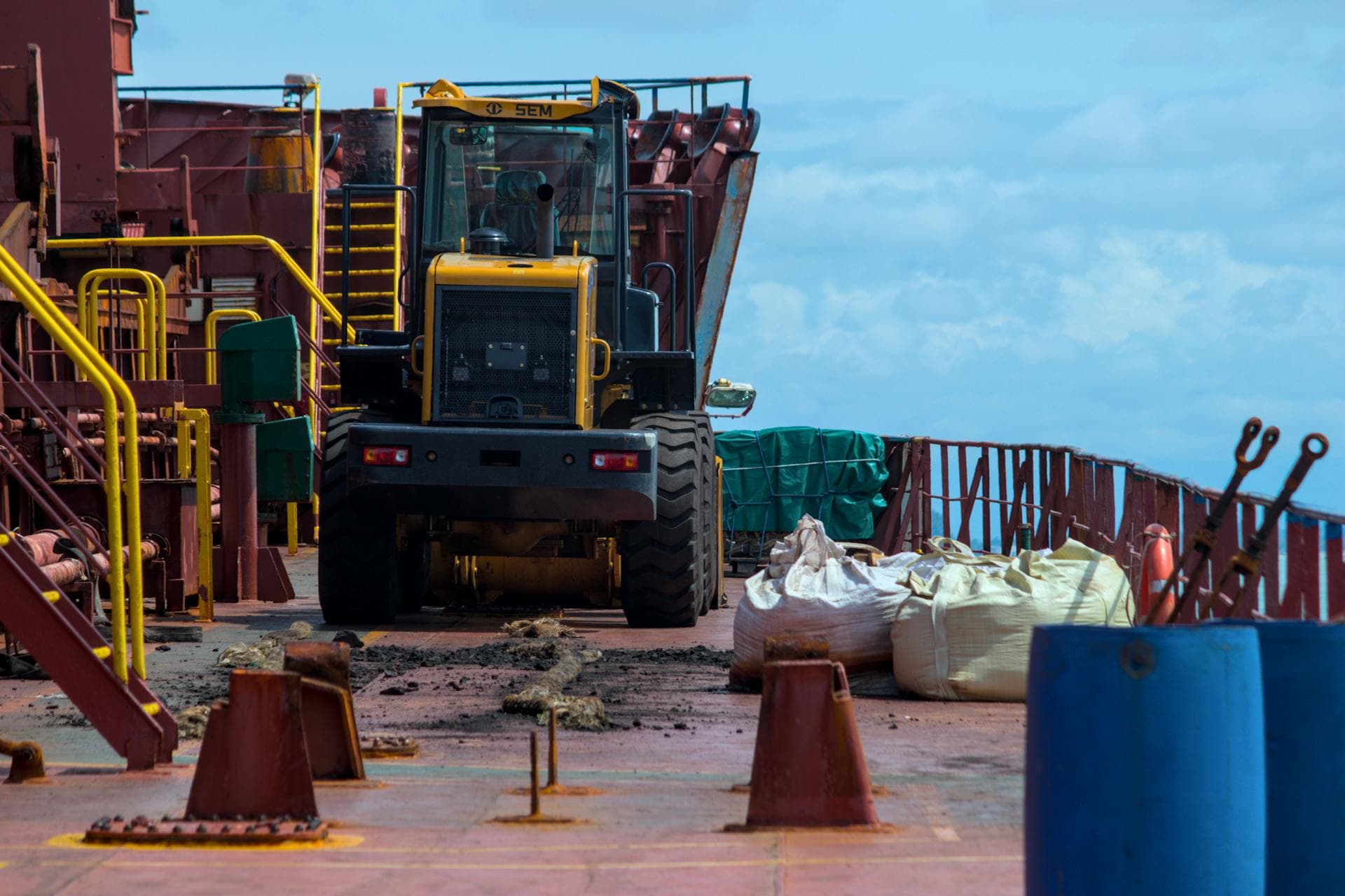 Heavy machinery on ship deck — Infinity Logistics marble transport project