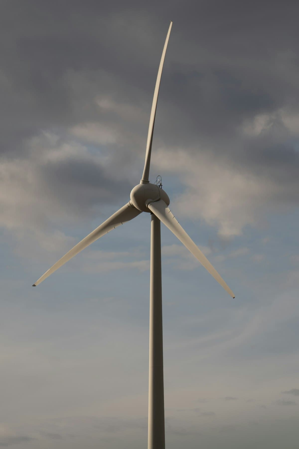 Wind turbine against cloudy sky — Infinity Logistics wind farm components project