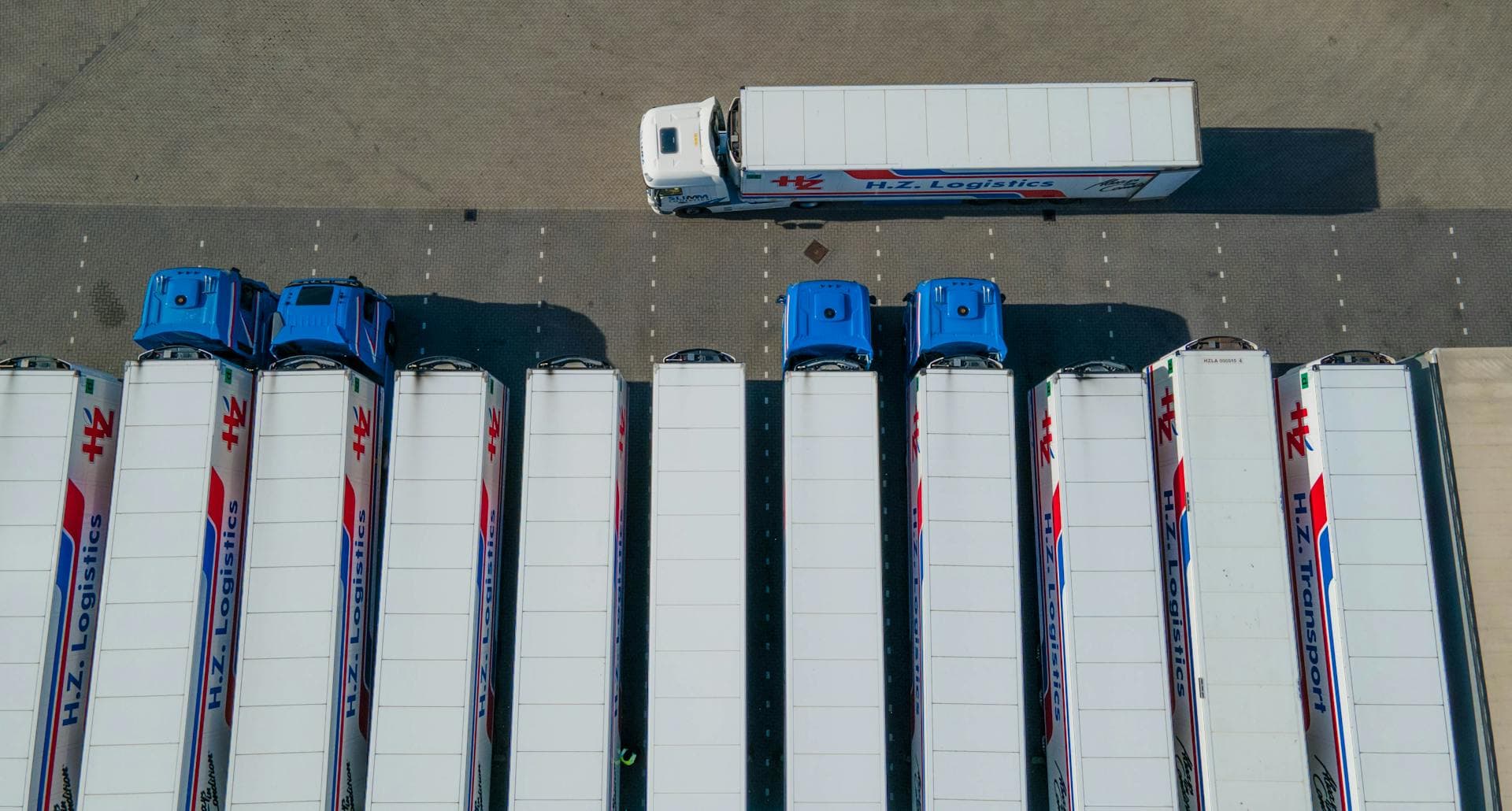 Aerial drone view of truck fleet — Infinity Logistics road freight GPS tracking and fleet management